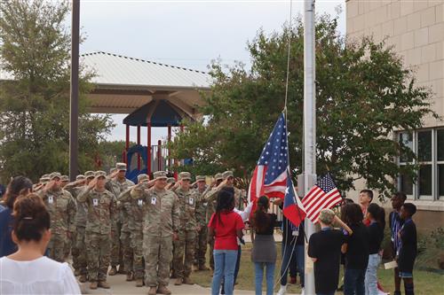 soldiers saluting flag detail raising flag