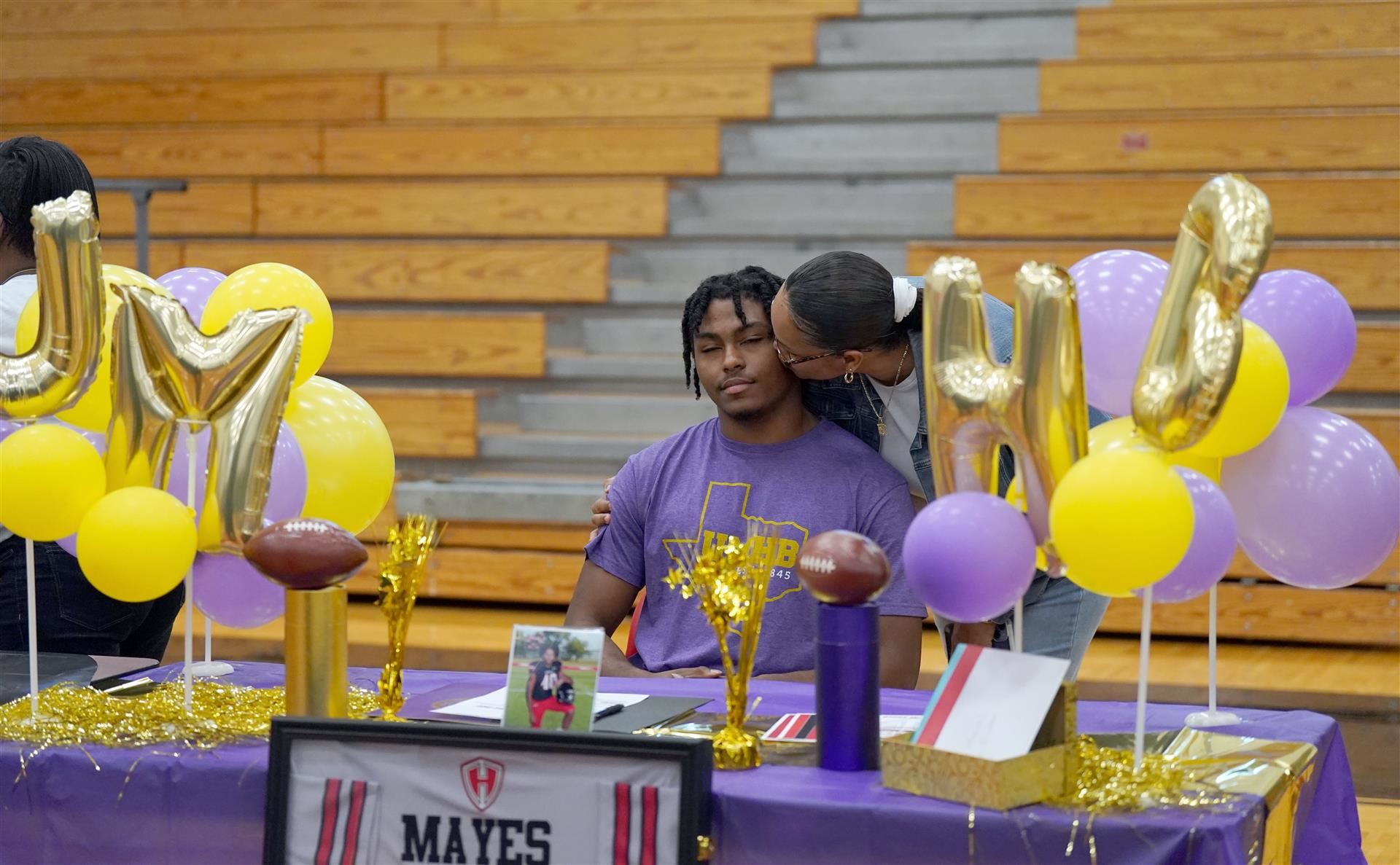 Parent and son signing day