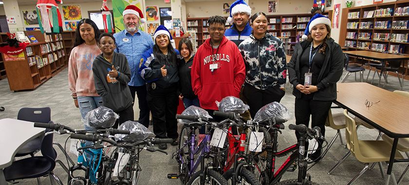  Blue Santa delivers bikes to Eastern Hills MS