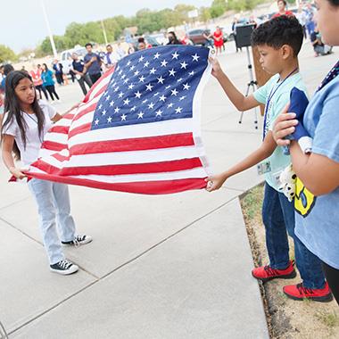 Cavazos students raise flags