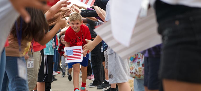 Cavazos Elementary students walk through tunnel during walk 