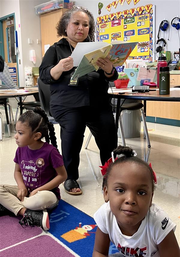 A.P. Chastain reading to classes